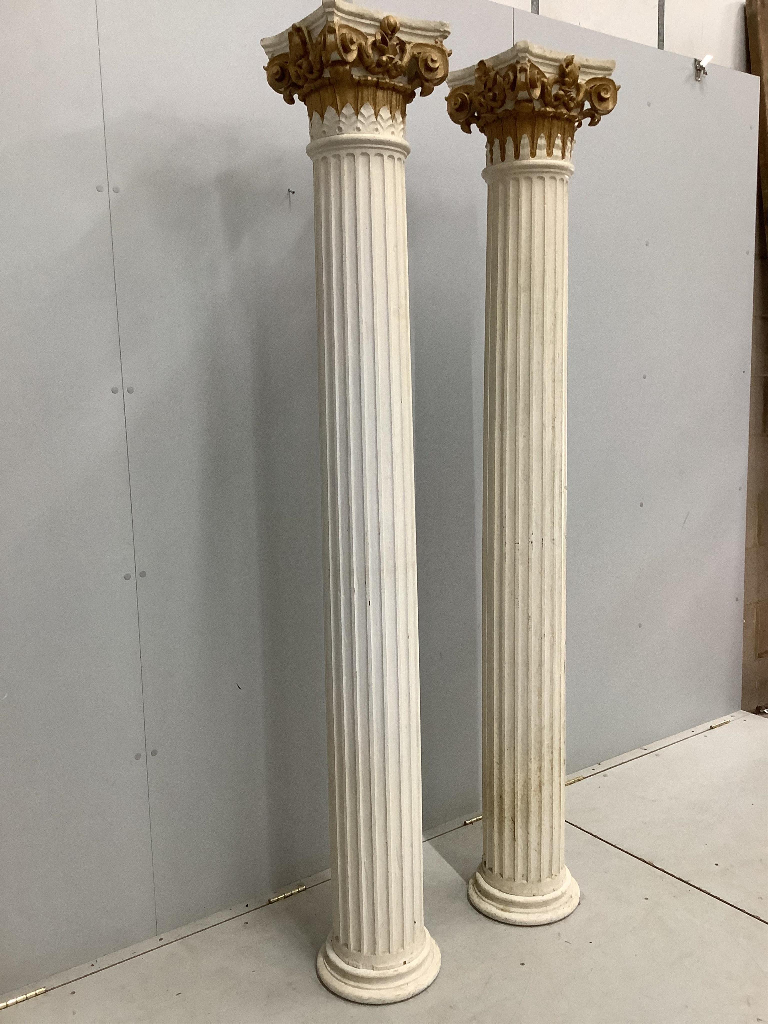 A pair of painted wooden Corinthian columns, height 205cm